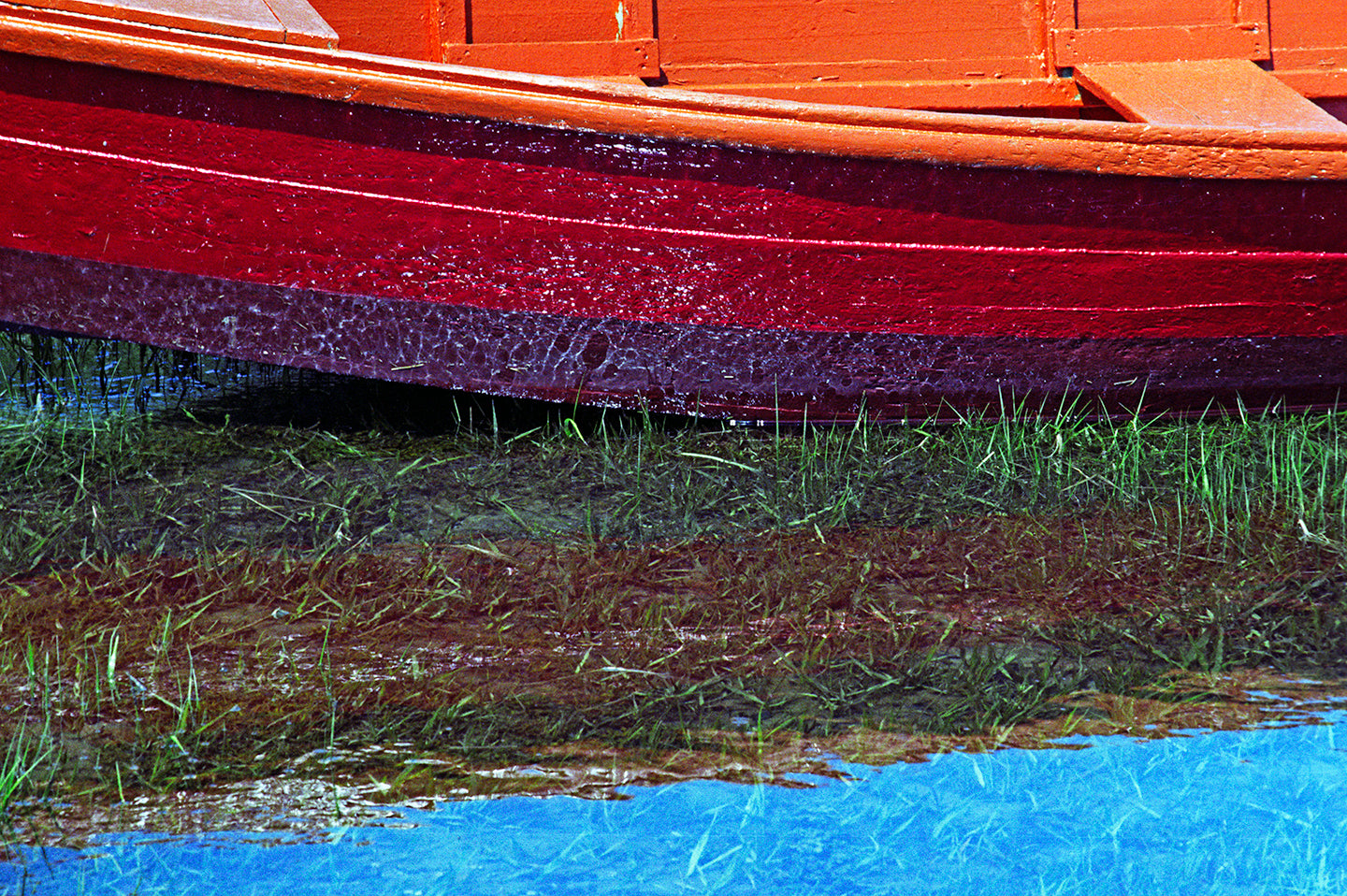 Red Rowboat with Reflection